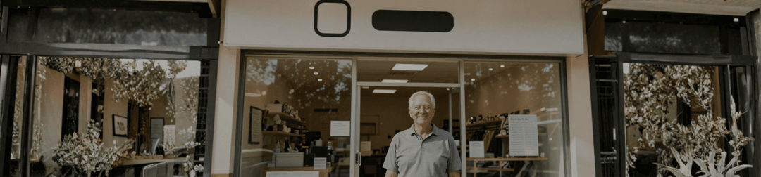 Australian small business owner with branded shopfront considering a trade mark
