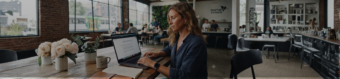 Australian founder typing a trade mark search question into an AI chatbot on a laptop.